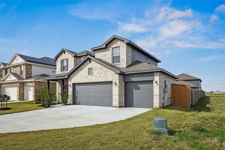 Front exterior of a new home in River Ranch Meadows, Dayton, TX, highlighting curb appeal (Image 19).