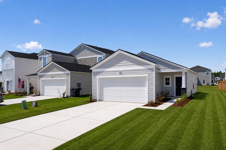 Front exterior of a new home in Lindera Preserve at Cane Bay Plantation, Summerville, SC, highlighting curb appeal (Image 1). Front exterior of a new home in Lindera Preserve at Cane Bay Plantation, Summerville, SC, highlighting curb appeal (Image 1).