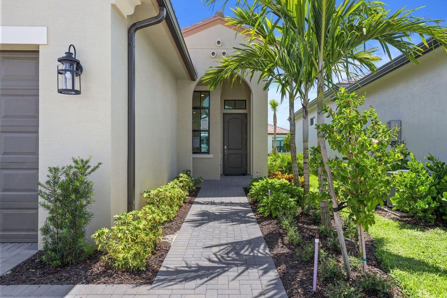 Front exterior of a new home in Cresswind Palm Beach at Westlake, Westlake, FL, highlighting curb appeal (Image 2).