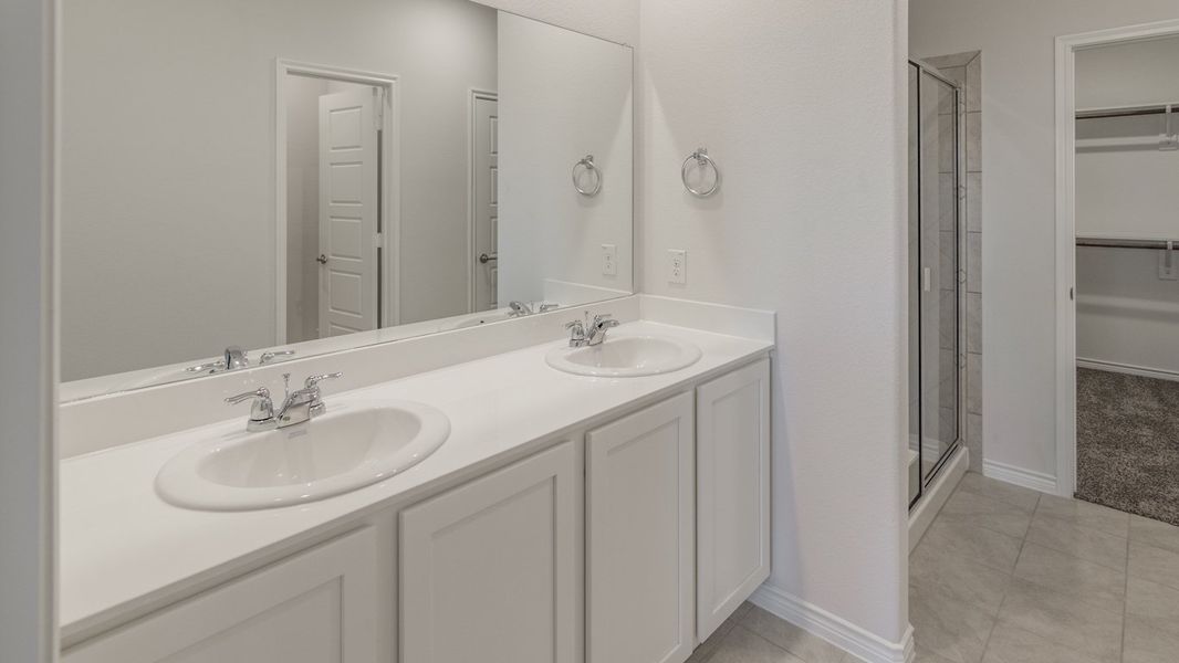 Representative furnished interior of a home built from the Medbourne by D.R. Horton in Woodcreek, Fate (Image 5).