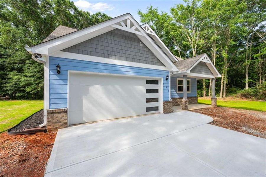Front exterior of a new home in , Commerce, GA, highlighting curb appeal (Image 25).