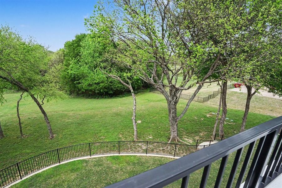 View of yard with a roof top deck