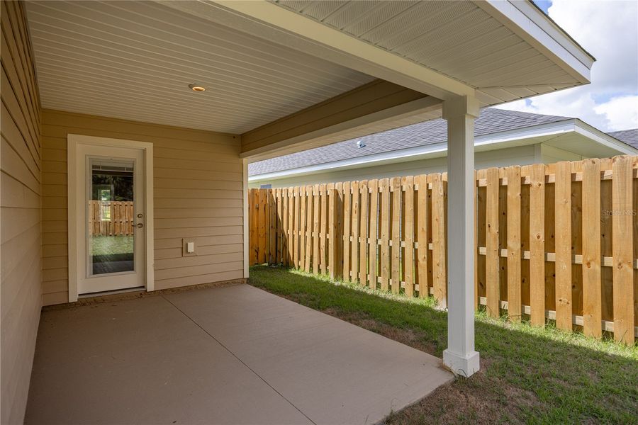 Exterior details and patio area of a home in Savannah Station, Alachua (Image 3).