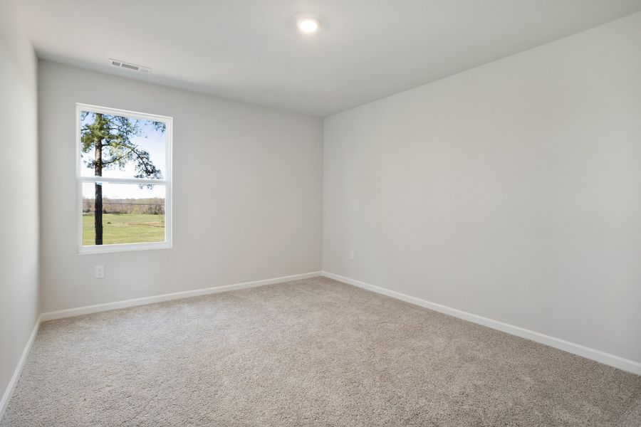 Spacious, unfurnished interior of a new home in Cambridge Reserve, Angier (Image 33).