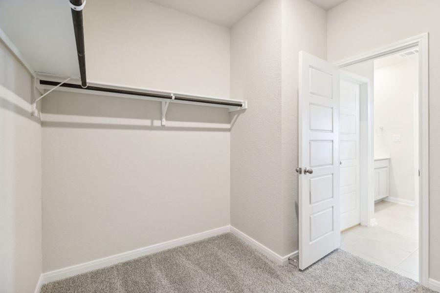 Primary suite walk-in closet in the Briscoe floorplan at a Meritage Homes community.