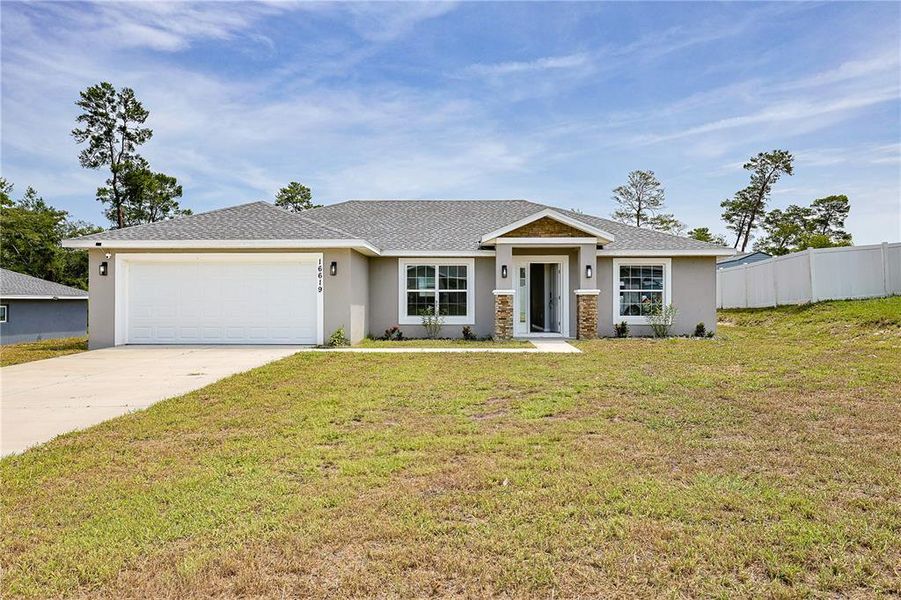 Front exterior of a new home in , Ocala, FL, highlighting curb appeal (Image 2). Front exterior of a new home in , Ocala, FL, highlighting curb appeal (Image 2).