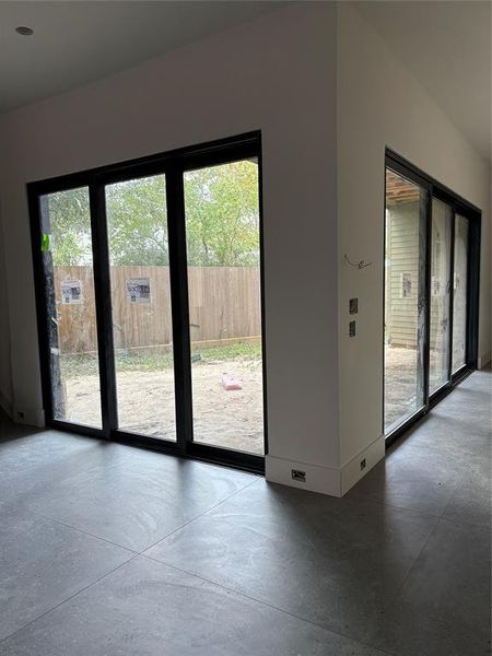 Doors open all the way up to enjoy full view of the pool coming soon to this courtyard area.  Also will have an outdoor shower.