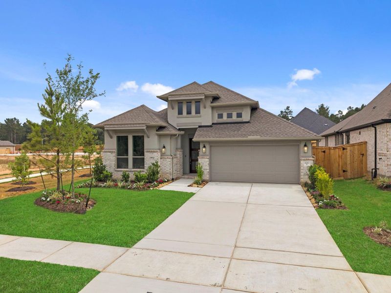 Front exterior of a new home in Wildtree, Magnolia, TX, highlighting curb appeal (Image 22).