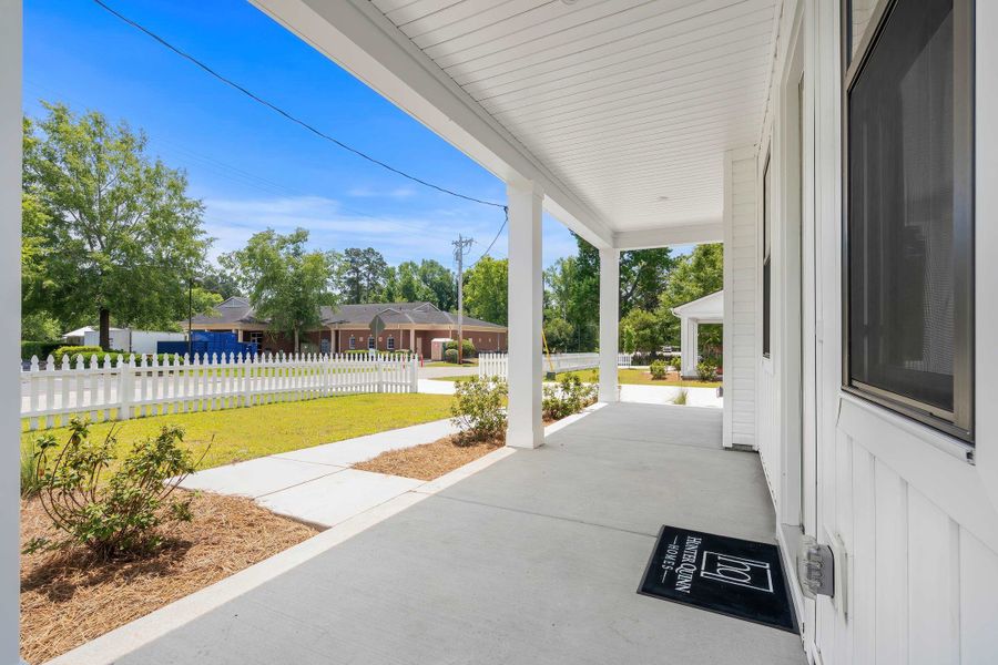 Exterior details and patio area of a home in Downtown Loris Homes, Loris (Image 3).