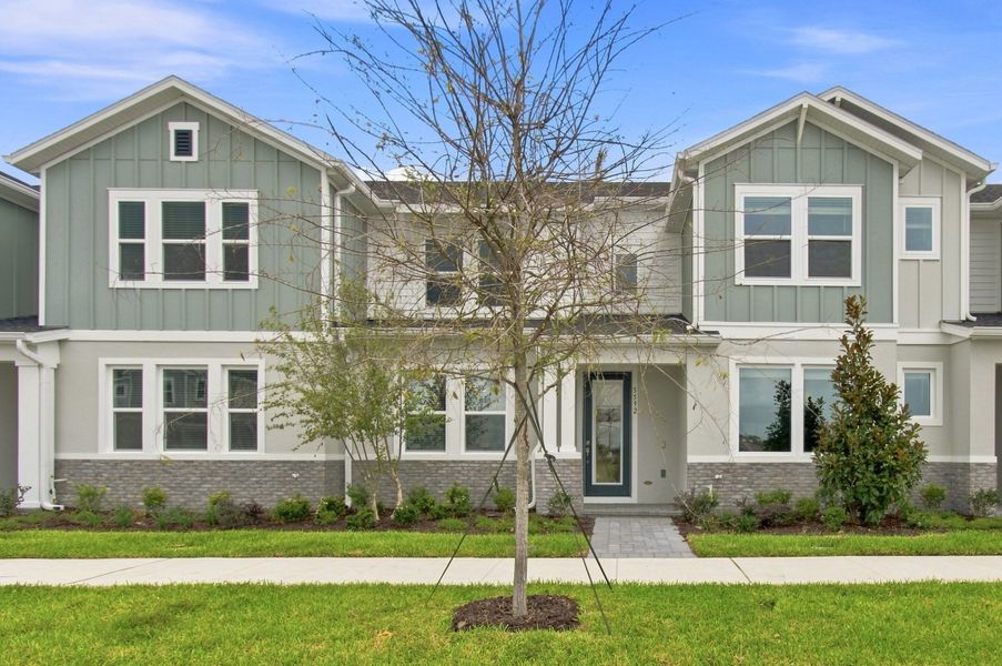 Front exterior of a new home in Palmeras at Crossprairie – The Palms Collection, St. Cloud, FL, highlighting curb appeal (Image 2). Front exterior of a new home in Palmeras at Crossprairie – The Palms Collection, St. Cloud, FL, highlighting curb appeal (Image 2).