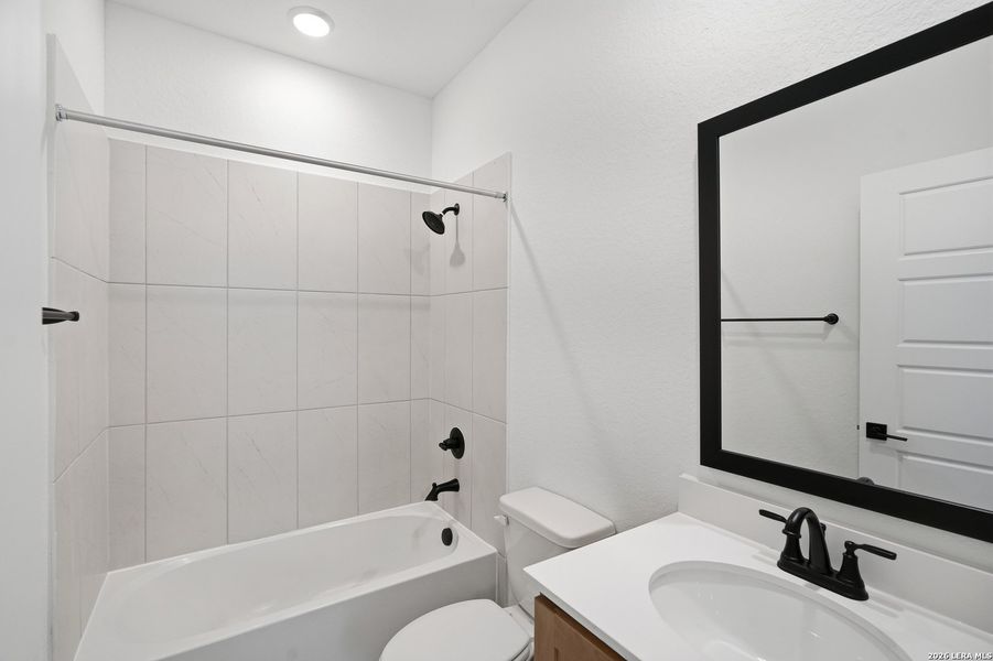 Furnished interior view inside a new home in Centero at Stone Oak, San Antonio (Image 17).