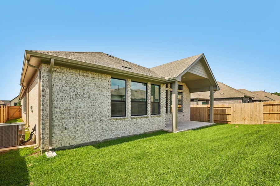 Exterior details and patio area of a home in Wood Leaf Reserve, Tomball (Image 3). Exterior details and patio area of a home in Wood Leaf Reserve, Tomball (Image 3).