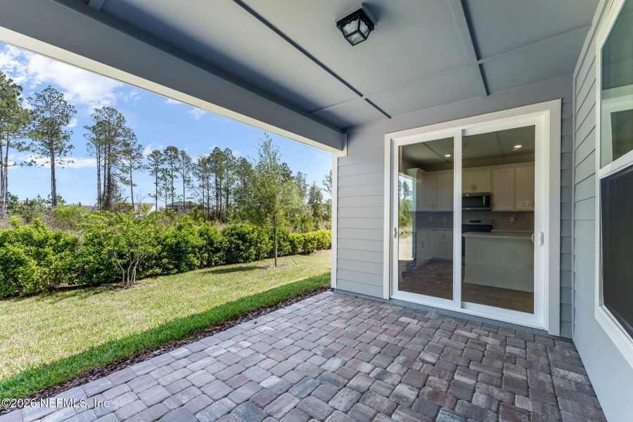 Exterior details and patio area of a home in Del Webb Wildlight, Yulee (Image 26).