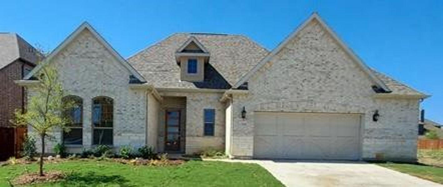 View of front of home featuring a garage