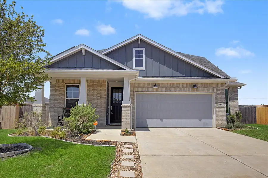 Front exterior of a new home in , Tomball, TX, highlighting curb appeal (Image 2). Front exterior of a new home in , Tomball, TX, highlighting curb appeal (Image 2).