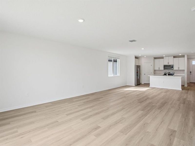 Spacious, unfurnished interior of a new home in The Grove at Stuart Crossing - Classic Series, Bartow (Image 26).