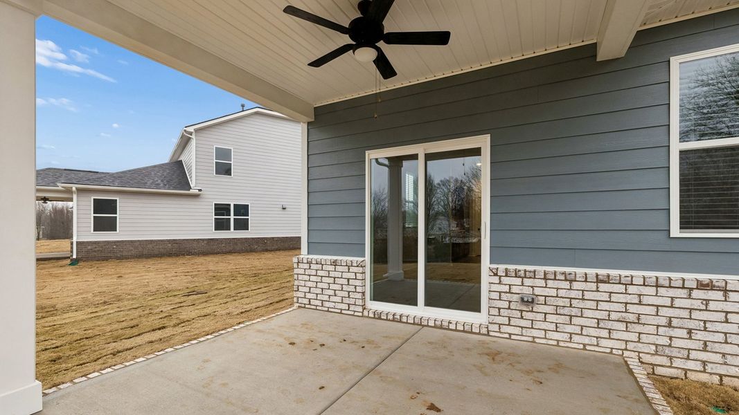 Exterior details and patio area of a home in Harvest Point, Spring Hill (Image 28).