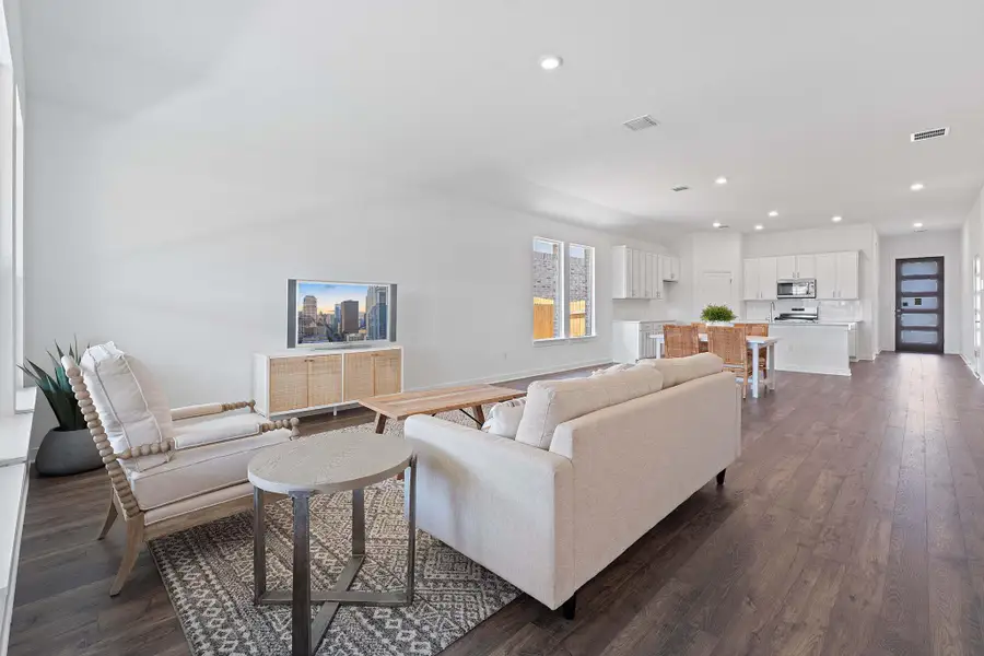 Living room featuring recessed lighting and dark wood finished floors Living room featuring recessed lighting and dark wood finished floors