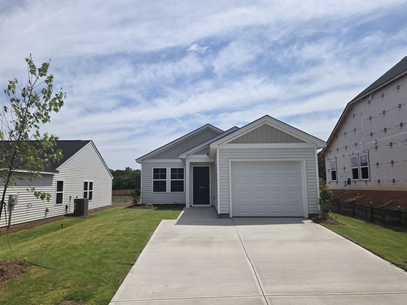 Front exterior of a new home in Evergreen, Spartanburg, SC, highlighting curb appeal (Image 1). Front exterior of a new home in Evergreen, Spartanburg, SC, highlighting curb appeal (Image 1).