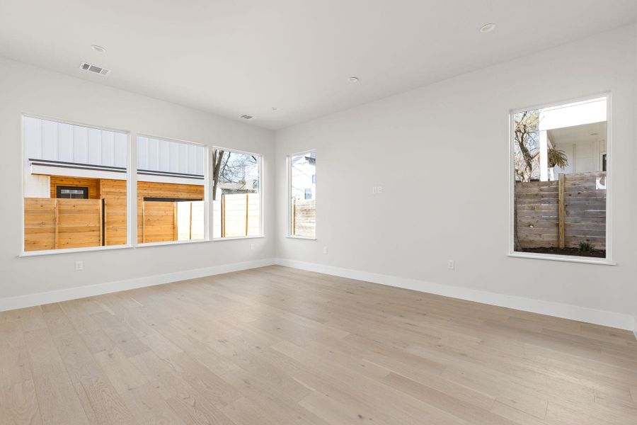 Living room with light wood-style flooring