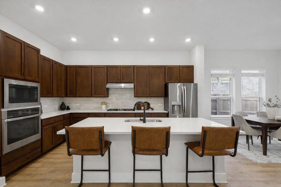 Kitchen (Staged)[Photos shown are from a completed home with the samefloorplan and similar design selections. Actual design selections may very slightly]