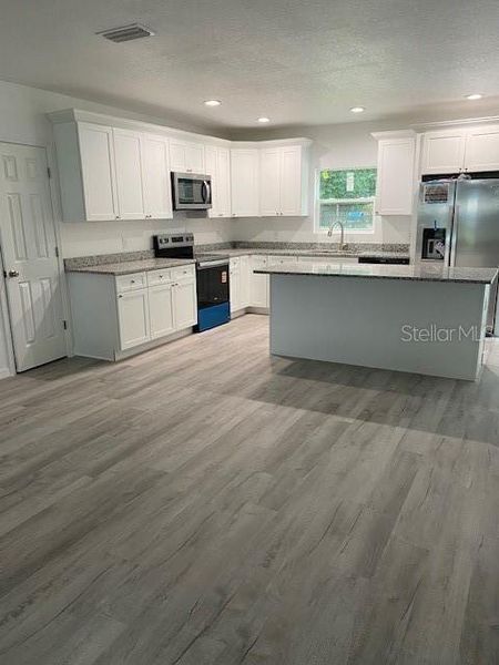 Furnished interior view inside a new home in , Gainesville (Image 8).