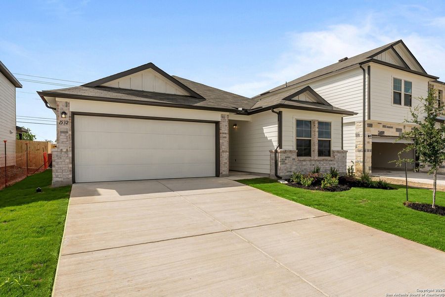 Front exterior of a new home in Meadows at Clear Springs, New Braunfels, TX, highlighting curb appeal (Image 18). Front exterior of a new home in Meadows at Clear Springs, New Braunfels, TX, highlighting curb appeal (Image 18).