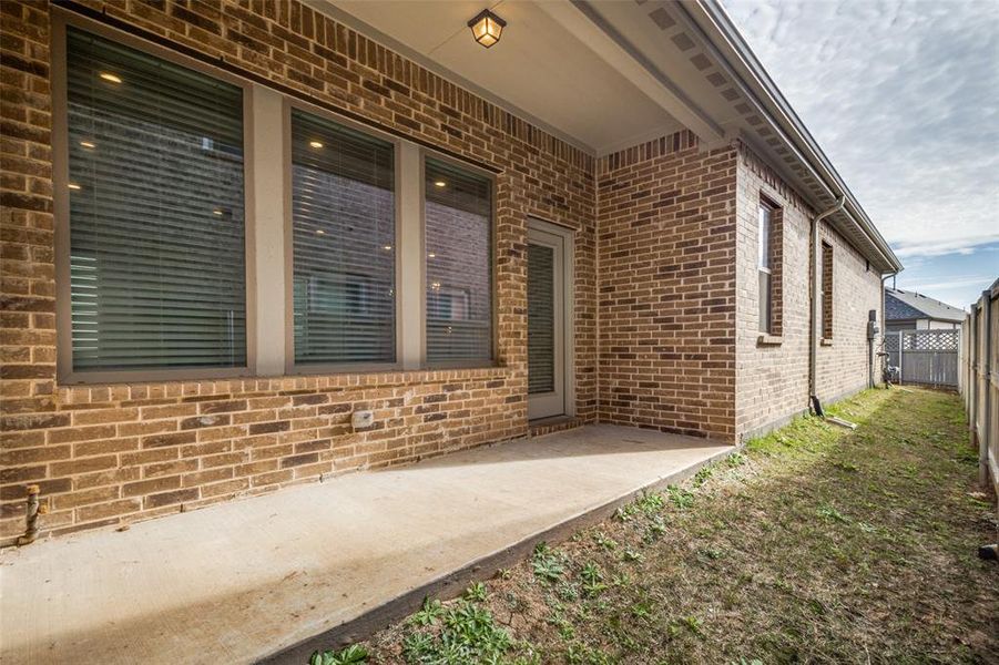 Property entrance featuring a patio area