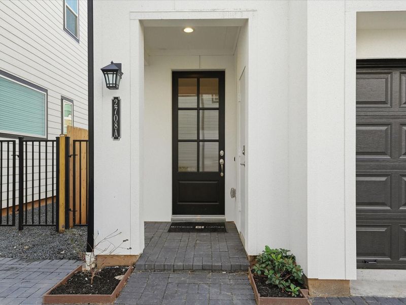 Exterior details and patio area of a home in The Corner At Buffalo Pointe, Houston (Image 3).