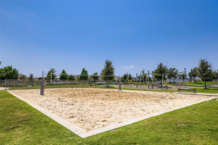 View of home's community with volleyball court