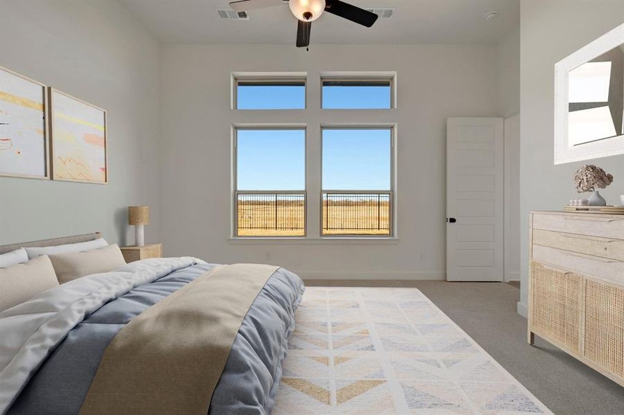 Carpeted bedroom featuring a ceiling fan and baseboards Carpeted bedroom featuring a ceiling fan and baseboards