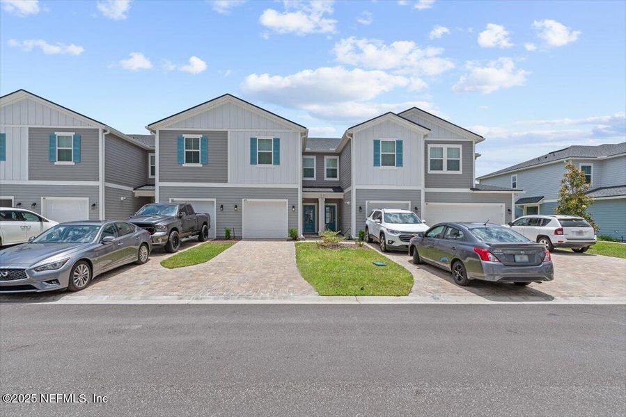 Front exterior of a new home in Brandon Lakes at Silver Landing, St. Augustine, FL, highlighting curb appeal (Image 27). Front exterior of a new home in Brandon Lakes at Silver Landing, St. Augustine, FL, highlighting curb appeal (Image 27).