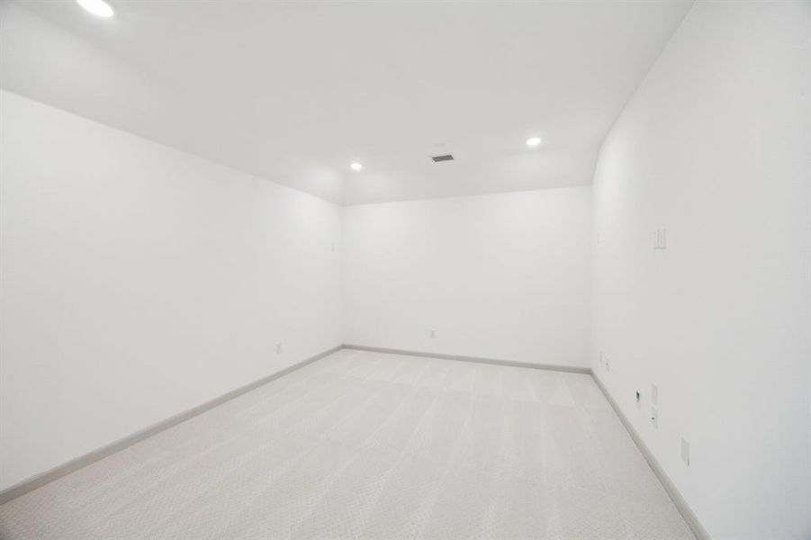 This media room, paired with the adjacent game room, creates the perfect entertaining space!