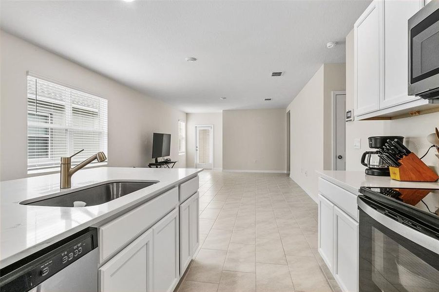 Furnished interior view inside a new home in Lake Deer Estates, Poinciana (Image 10).