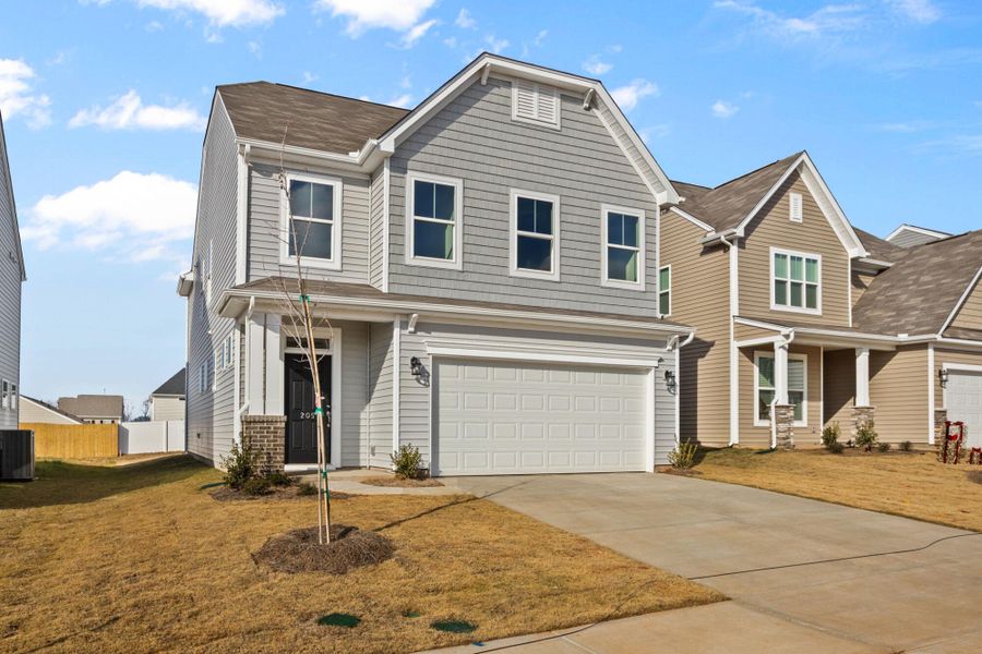 Front exterior of a new home in Harrington, Greenville, SC, highlighting curb appeal (Image 2). Front exterior of a new home in Harrington, Greenville, SC, highlighting curb appeal (Image 2).