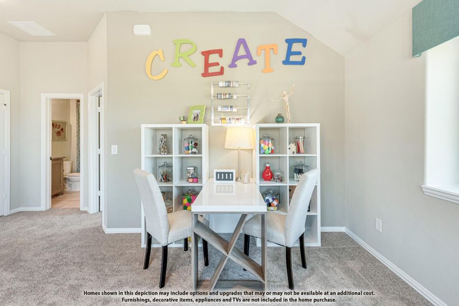 Craft room with white desk, cube shelving, and colorful "CREATE" wall letters on vaulted ceiling wall Craft room with white desk, cube shelving, and colorful "CREATE" wall letters on vaulted ceiling wall