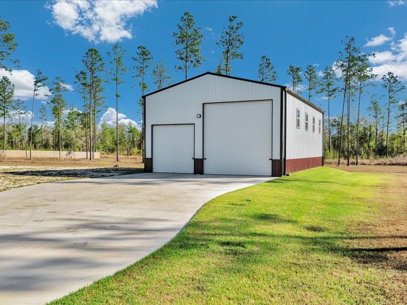 Front exterior of a new home in , Diboll, TX, highlighting curb appeal (Image 1).