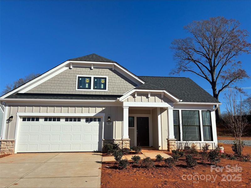 Front exterior of a new home in The Courtyards at Hodges Farm, Charlotte, NC, highlighting curb appeal (Image 1). Front exterior of a new home in The Courtyards at Hodges Farm, Charlotte, NC, highlighting curb appeal (Image 1).