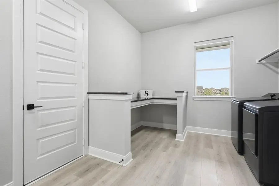 The Generously-Sized Utility Room Offers A Large Folding Area And Linen Closet.