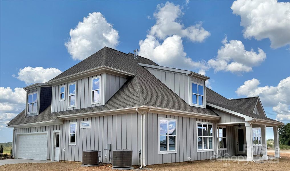 Front exterior of a new home in , Waxhaw, NC, highlighting curb appeal (Image 24).
