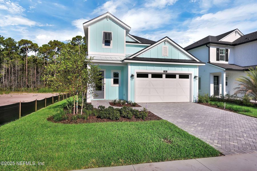 Front exterior of a new home in Reflections at Nocatee, Ponte Vedra, FL, highlighting curb appeal (Image 2).