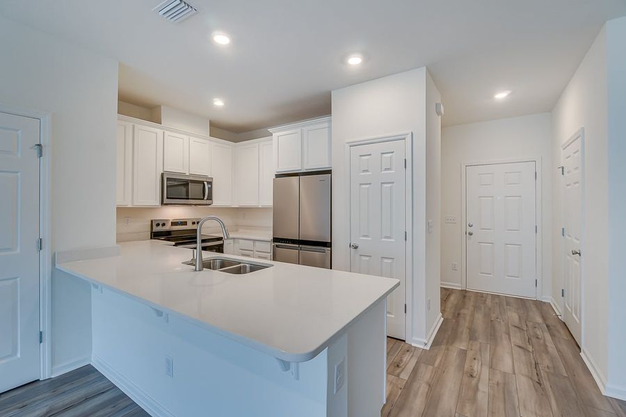 Furnished interior view inside a new home in Orchard Park Townhomes, St. Augustine (Image 5).