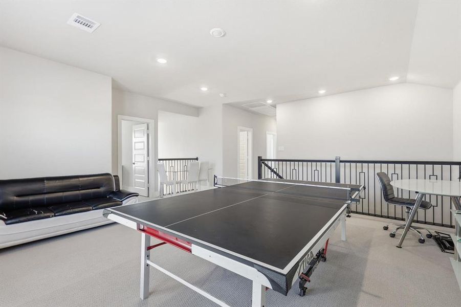 Game room featuring carpet floors, recessed lighting, and a desk