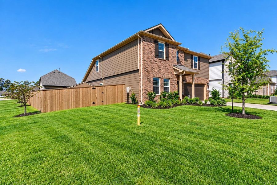 Beautiful curb appeal on a spacious corner lot and a large fenced backyard—plenty of outdoor space to enjoy! *virtually enhanced*