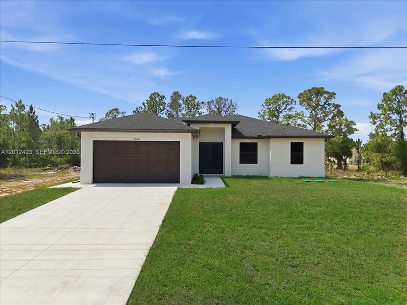 Front exterior of a new home in , Lehigh Acres, FL, highlighting curb appeal (Image 25).