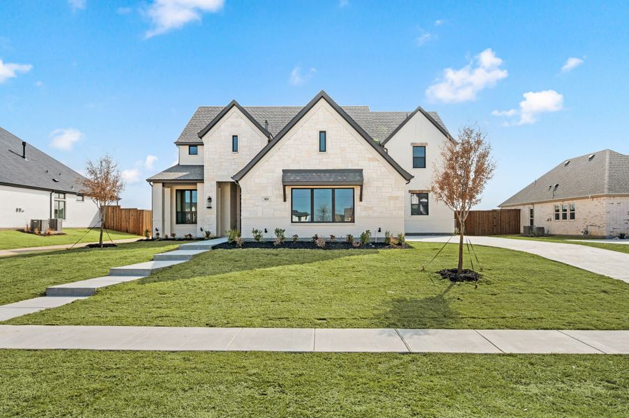 Front exterior of a new home in NorthGlen, Haslet, TX, highlighting curb appeal (Image 1). Front exterior of a new home in NorthGlen, Haslet, TX, highlighting curb appeal (Image 1).