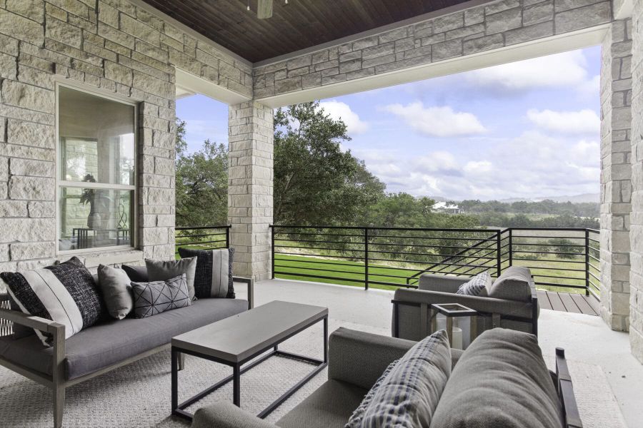 Covered outdoor living area in Ashlyn home at Belle Oaks, Bulverde TX