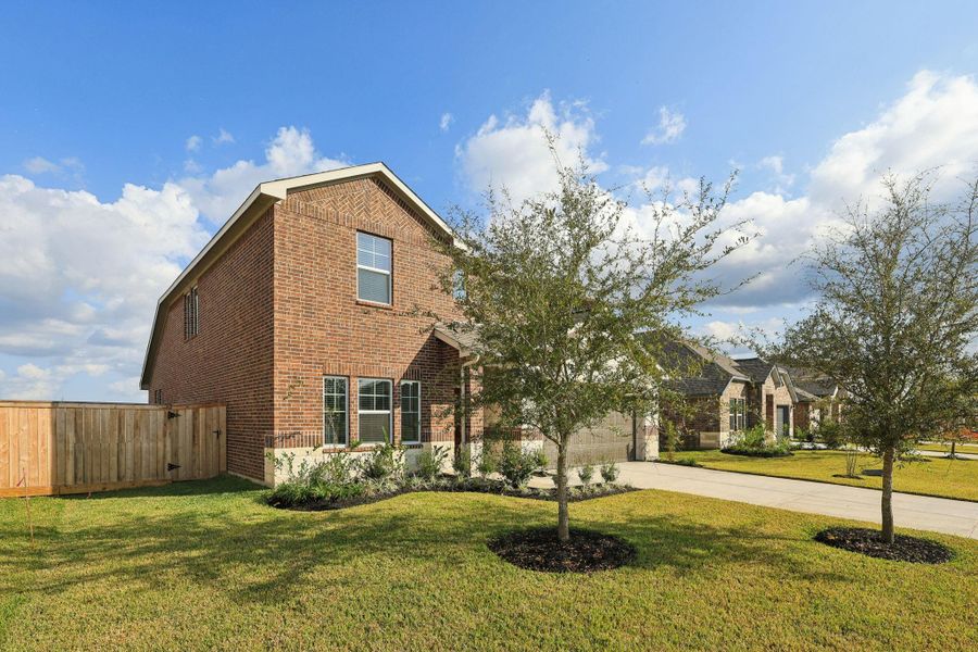 Front exterior of a new home in Massey Oaks - Premier Series, Pearland, TX, highlighting curb appeal (Image 2). Front exterior of a new home in Massey Oaks - Premier Series, Pearland, TX, highlighting curb appeal (Image 2).