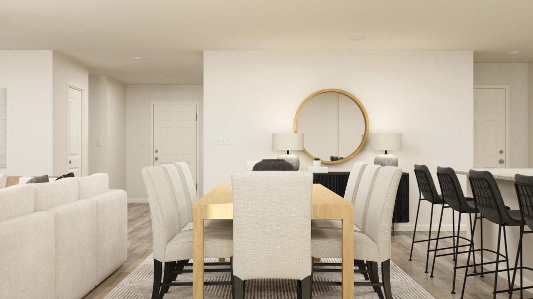 A room with a table chairs and a mirror. A room with a table chairs and a mirror.