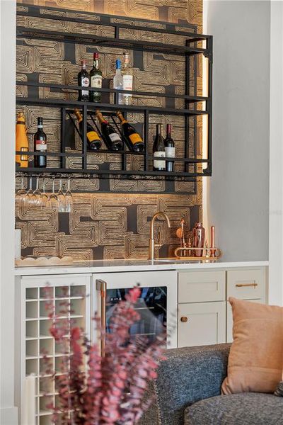 Custom wet bar with sink and wine fridge Custom wet bar with sink and wine fridge